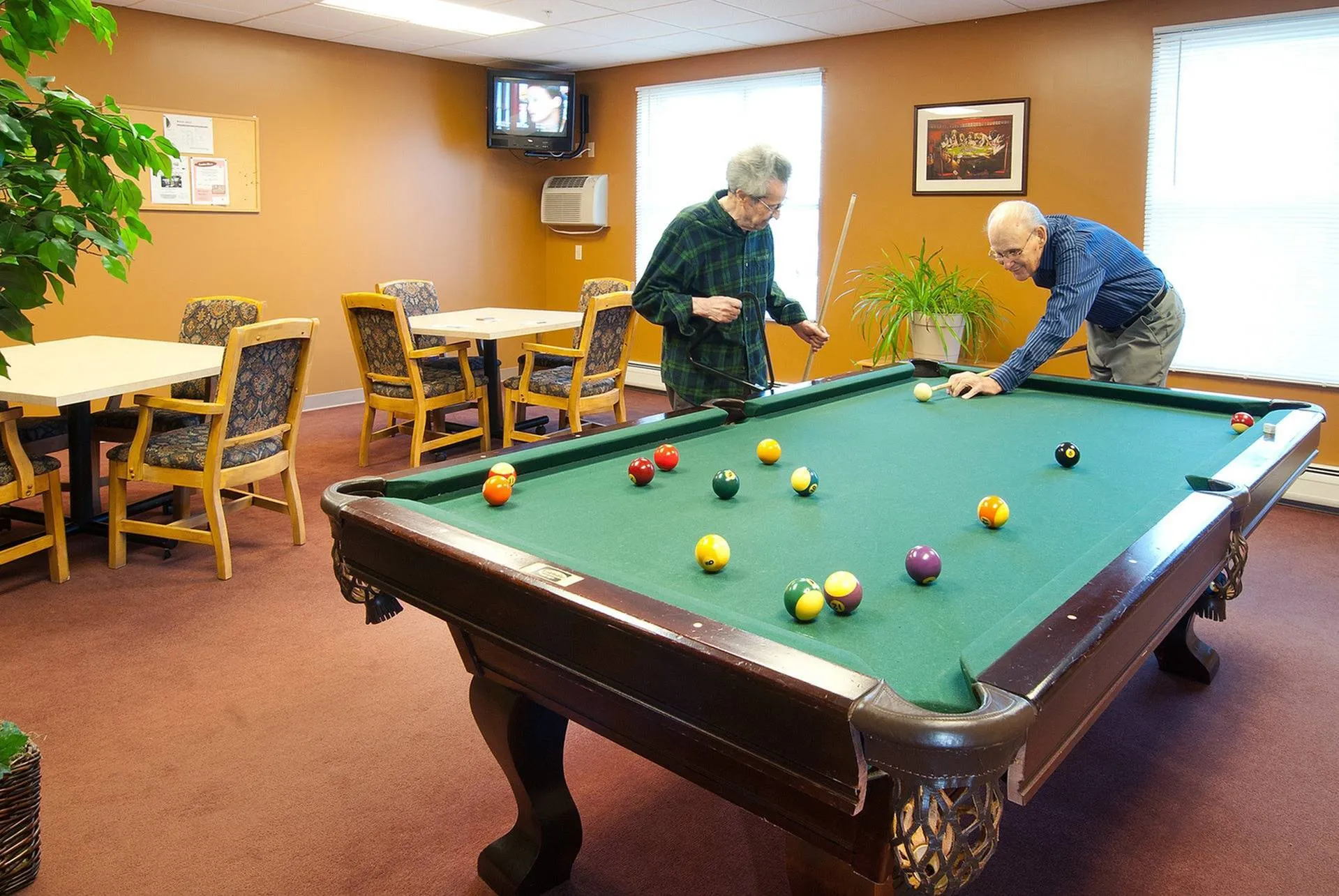 Residents Playing Pool | Apartment Homes in Middletown, NY | The Wallkill Living Center