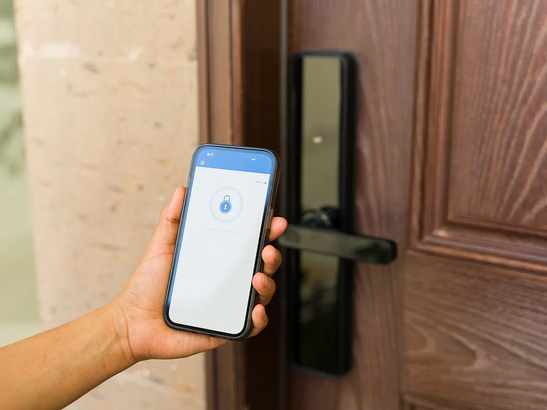 Innovative smart lock system with mobile app integration showcased on a stylish wooden door.