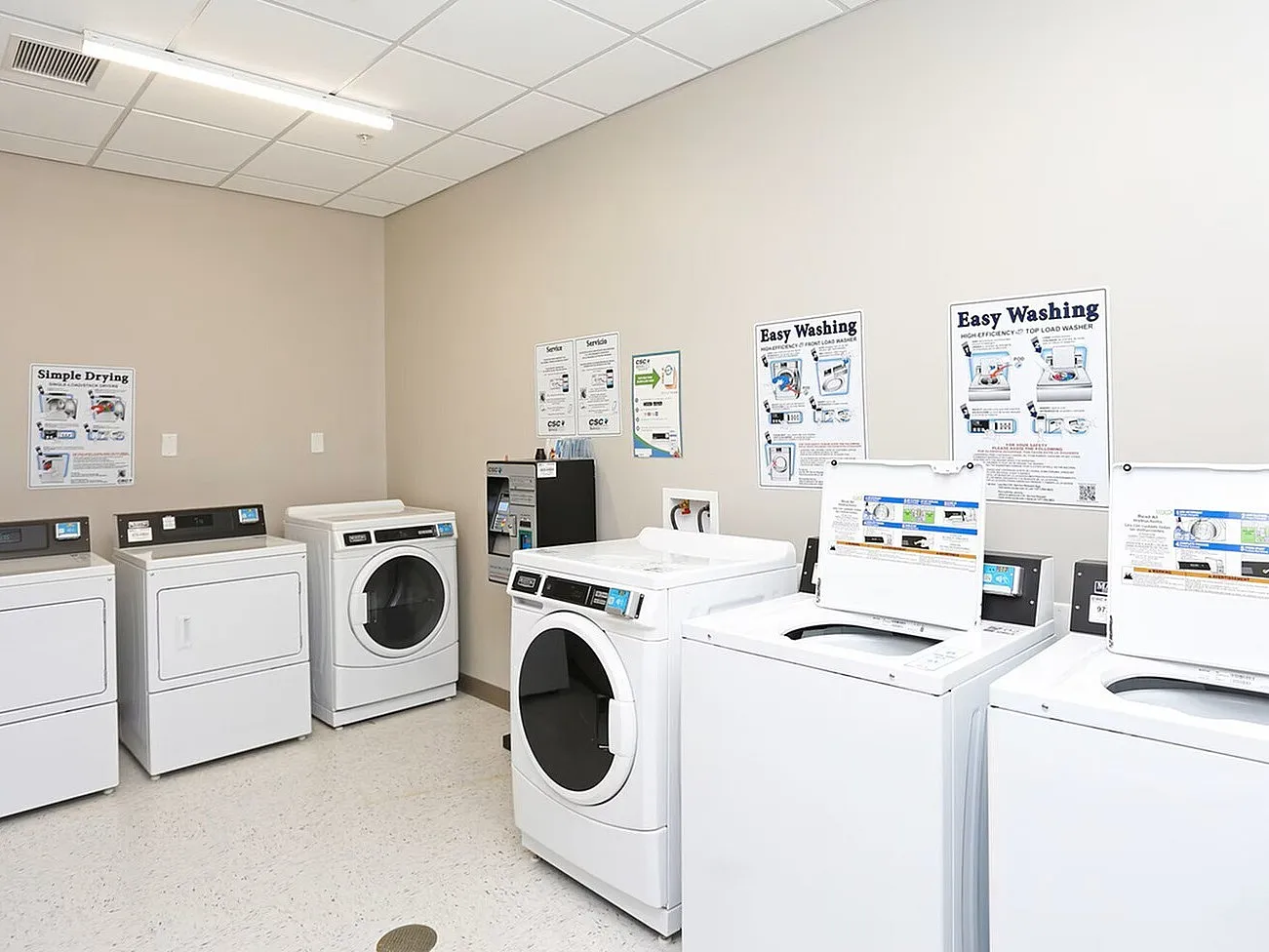 Modern laundry room equipped with state-of-the-art washers and dryers, providing convenience and efficiency for residents.