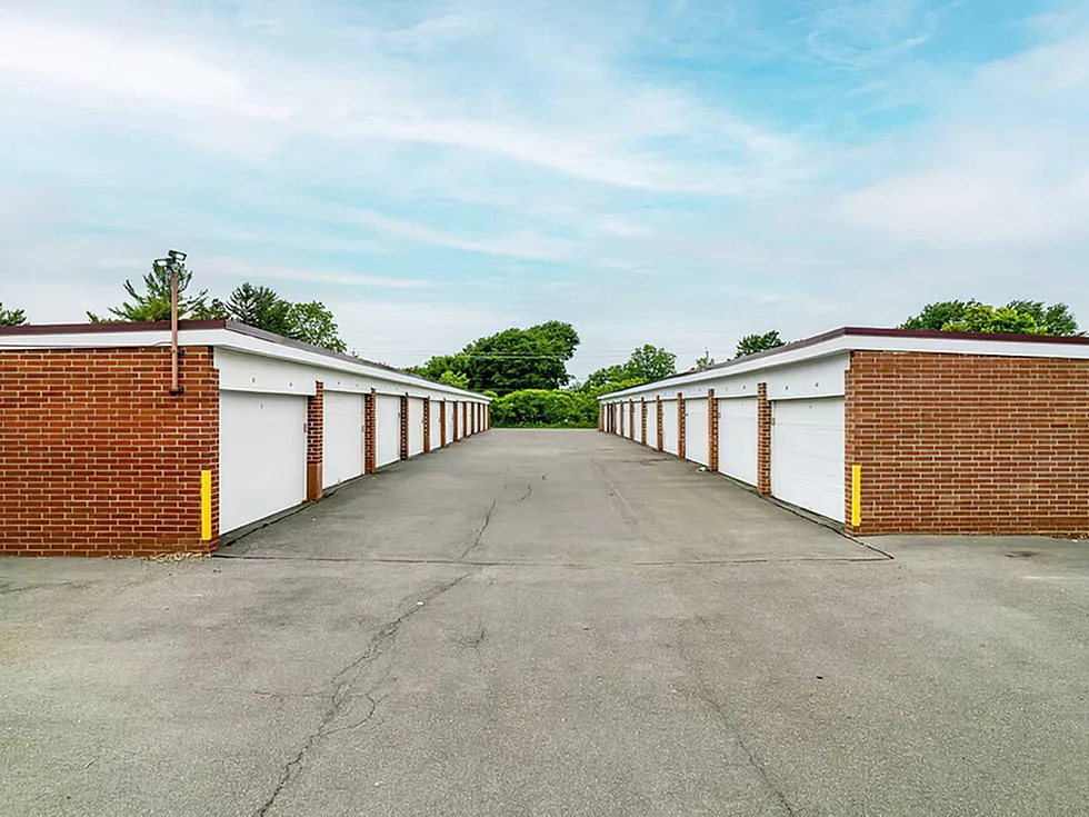 Spacious outdoor row of modern storage units with brick facades, perfect for secure and convenient storage solutions.