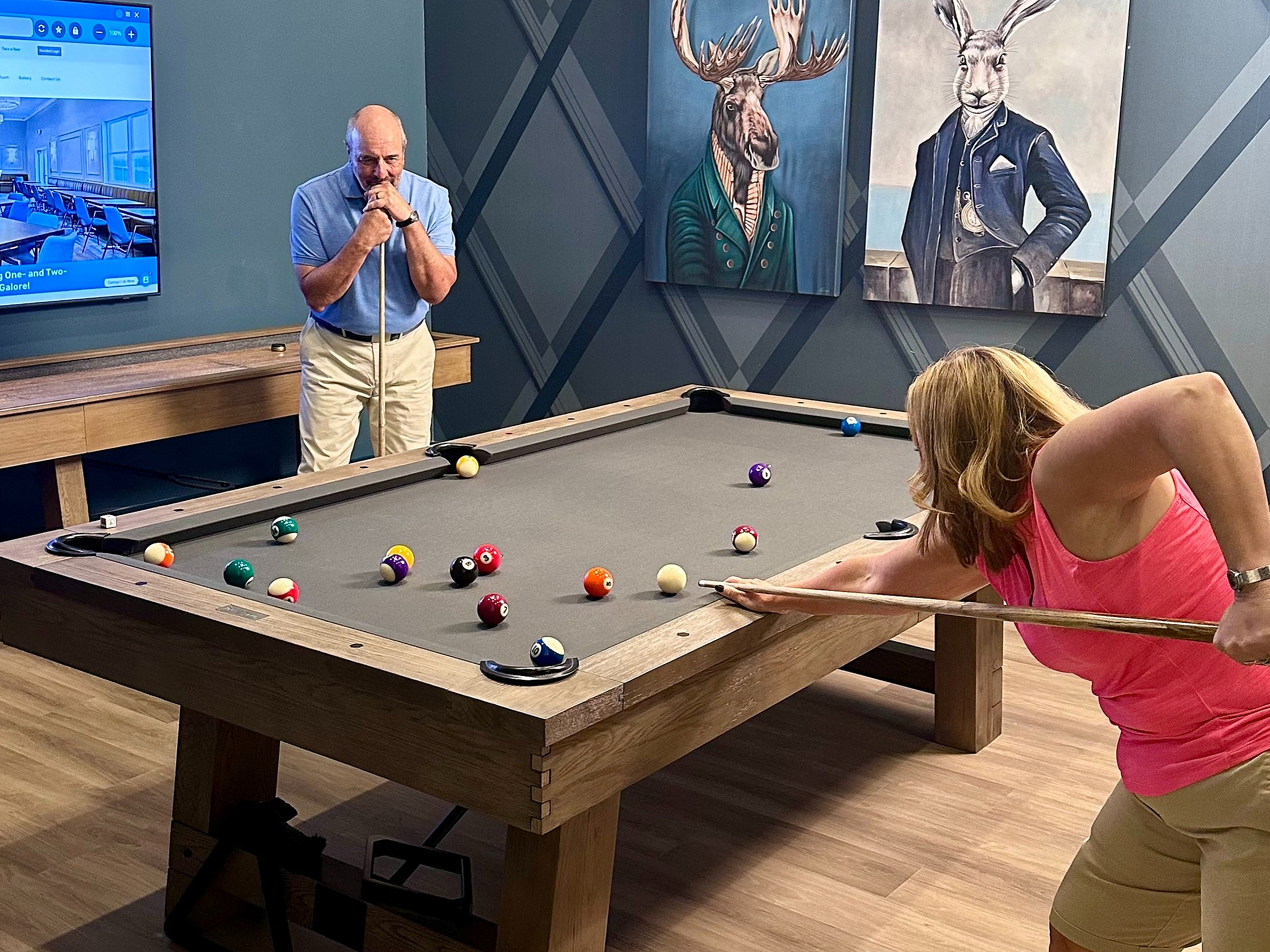 Chic game room with elegant pool table, modern decor, and engaging atmosphere for leisure and relaxation.