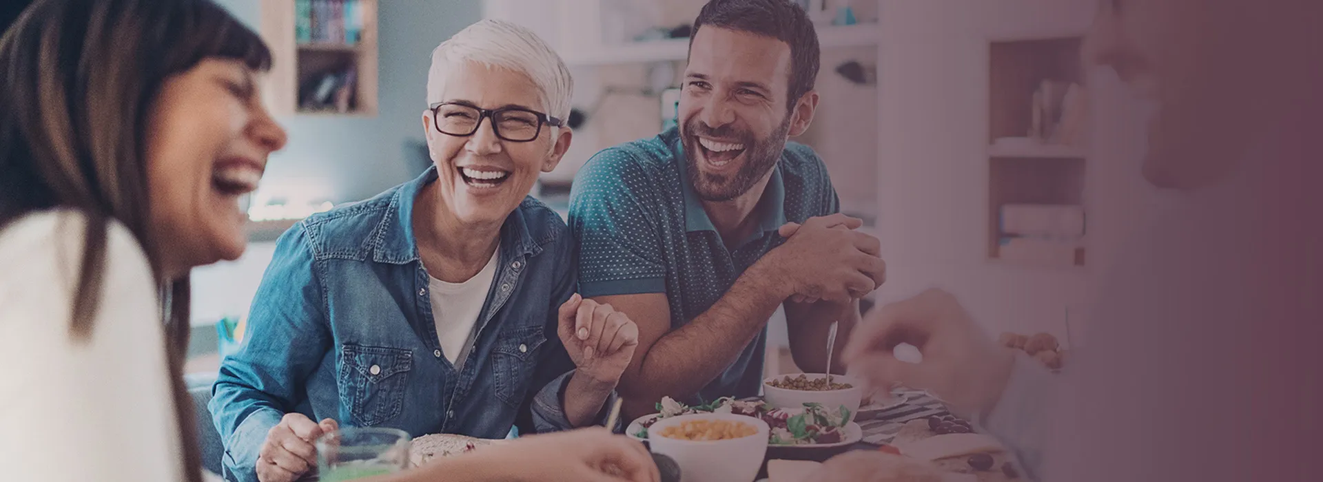 people laughing at dinner