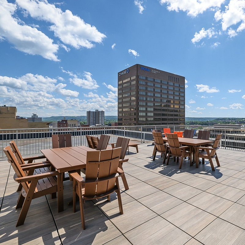 Stunning rooftop terrace with modern seating and panoramic views, perfect for outdoor gatherings and relaxation.
