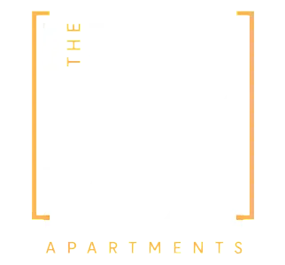 Modern logo design for The Uncommon Apartments with sleek typography and stylish orange accents.