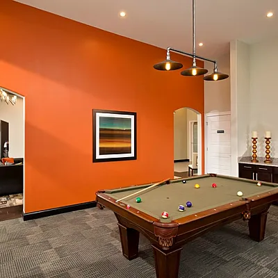 Kensington clubhouse room featuring a billiards table and modern decor.