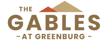 Elegant logo for The Gables at Greenburg featuring minimalist roof silhouettes in warm tones, highlighting a sophisticated housing community.