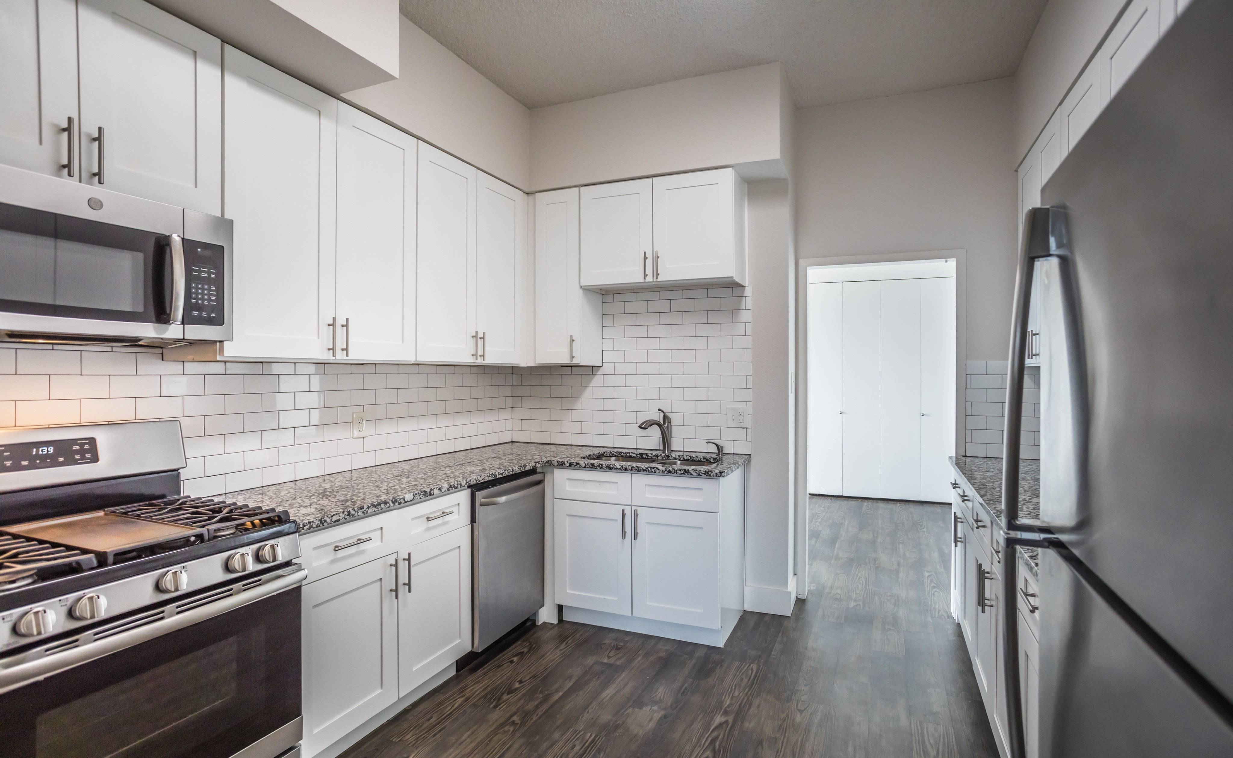 Granite Countertops and stainless steel appliances in newly renovated apartment