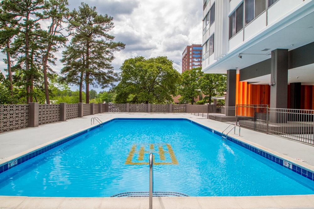 Sun drenched swimming pool at The Highland Midtown Apartments in Little Rock