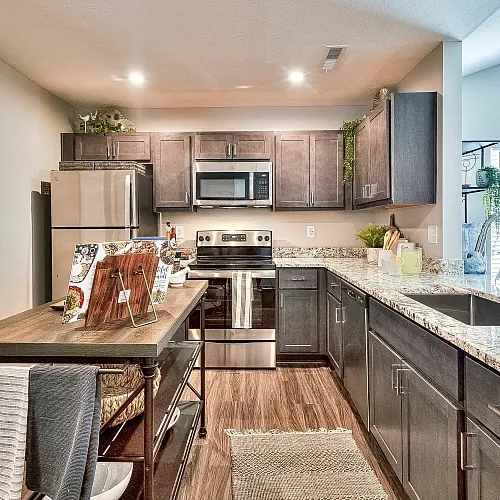 Contemporary kitchen with sleek cabinets, stainless steel appliances, and granite countertops.