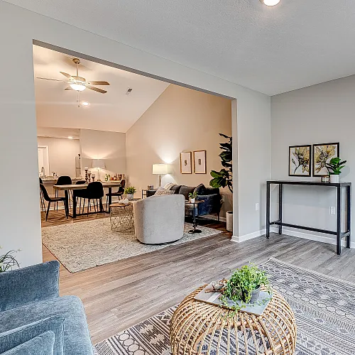 Elegant living space with modern decor, featuring a cozy seating area, dining table, and stylish accents.