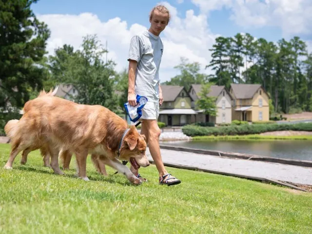 Residents Playing with their Pets | The Cottages of Hattiesburg | Student Apartments In Hattiesburg MS