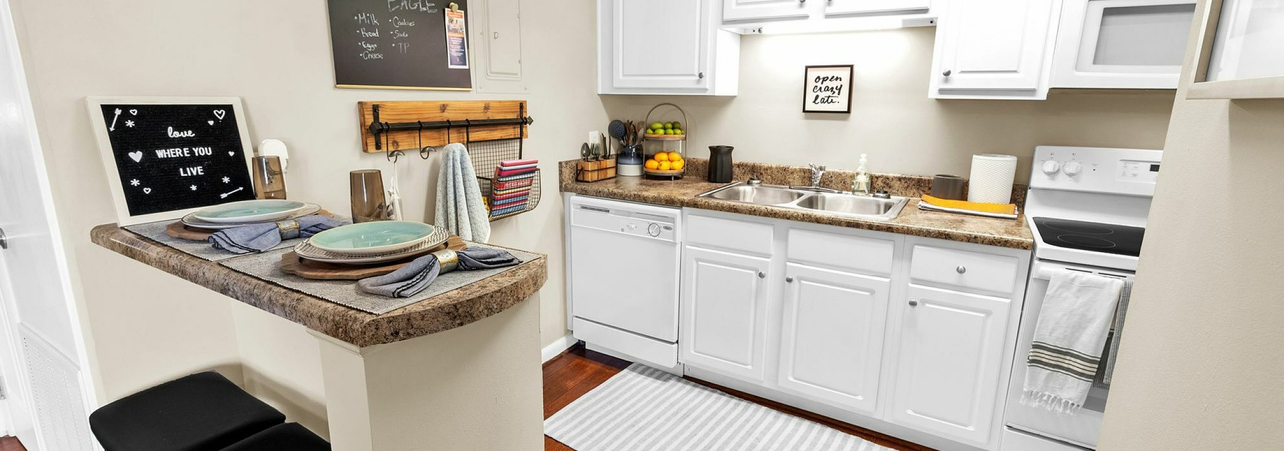 Charming kitchen with stylish breakfast bar, white cabinetry, and elegant decor, perfect for cozy living.