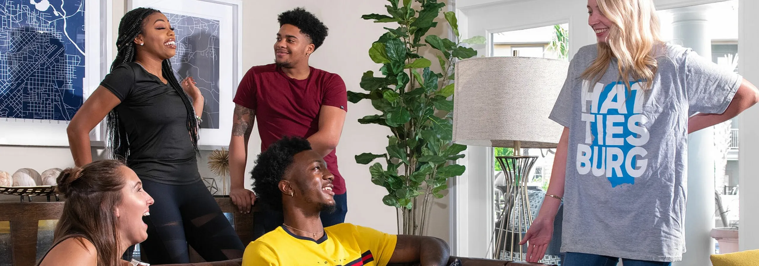 Bright and inviting living room with a group of friends enjoying a lively conversation on a stylish leather sofa, framed by modern decor and natural light.