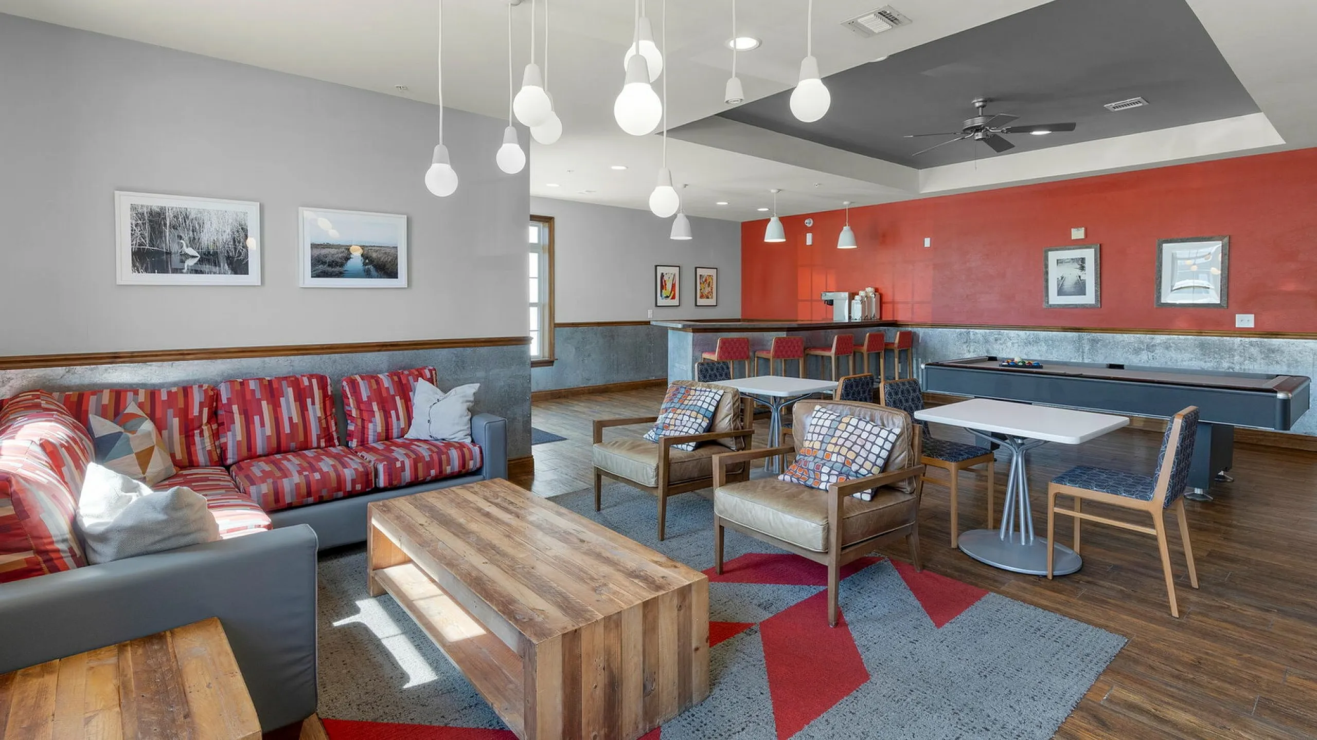 Inviting living room with colorful modern decor, cozy seating, and stylish lighting, perfect for relaxation and entertainment.