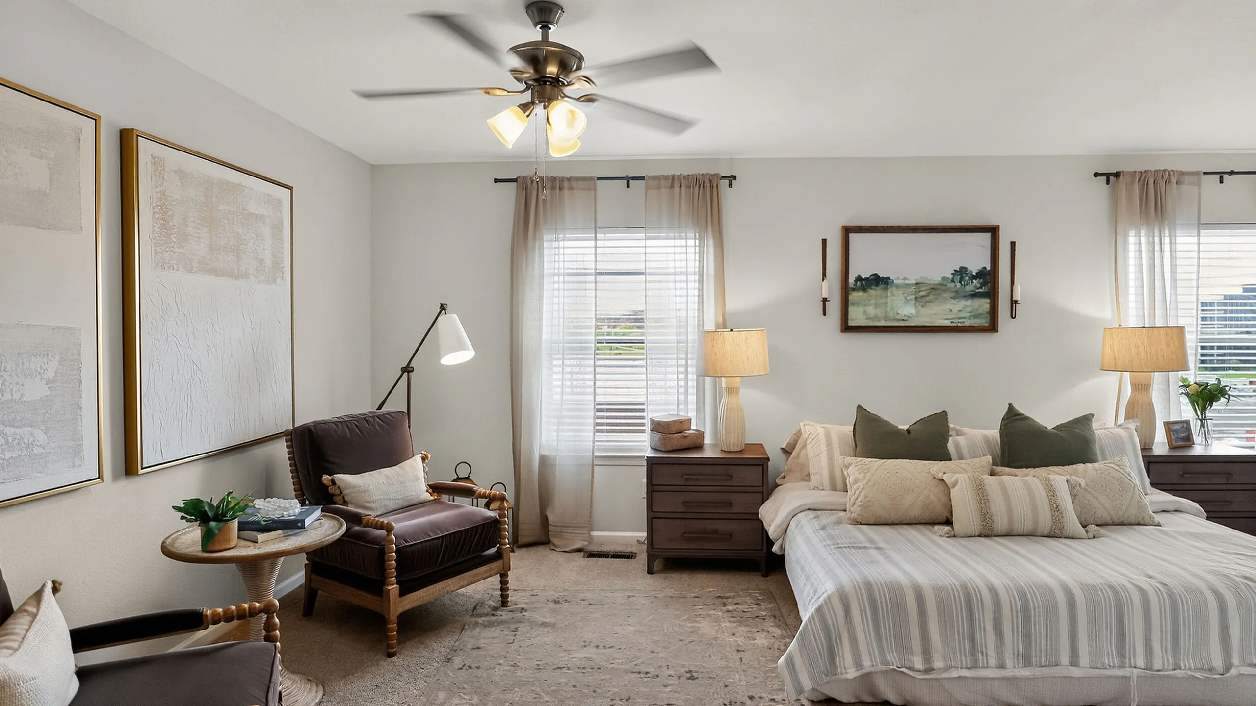 Elegant bedroom showcasing a plush double bed with accent pillows, cozy armchairs, and a serene ambiance enhanced by soft lighting and tasteful decor.
