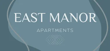 Logo for East Manor Apartments in Springfield, Missouri: the words “EAST MANOR” in large light-gray serif uppercase letters on a muted blue-gray background, with “APARTMENTS” in smaller uppercase below and a geometric diamond-grid i
