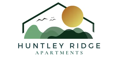 Logo for Huntley Ridge Apartments featuring a modern rooftop outline framing green rolling hills, a golden sun, and flying birds, symbolizing peaceful living surrounded by nature.