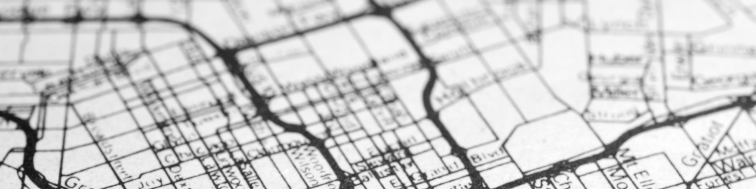 Vintage-style city map showcasing intricate street grid highlighting connectivity and urban planning.