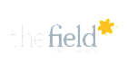 The Field Apartments logo with a bright yellow star accent, conveying a vibrant and welcoming community.