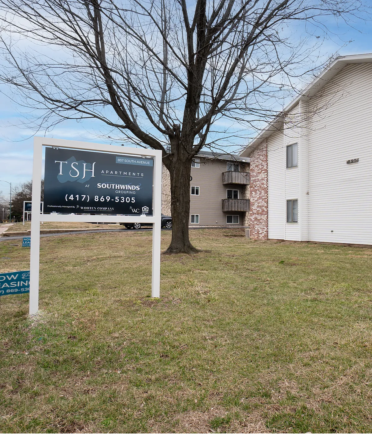 Inviting TSH Apartments building exterior showing modern design and lush green surroundings, ideal for serene living. Now leasing at Southwinds Group.
