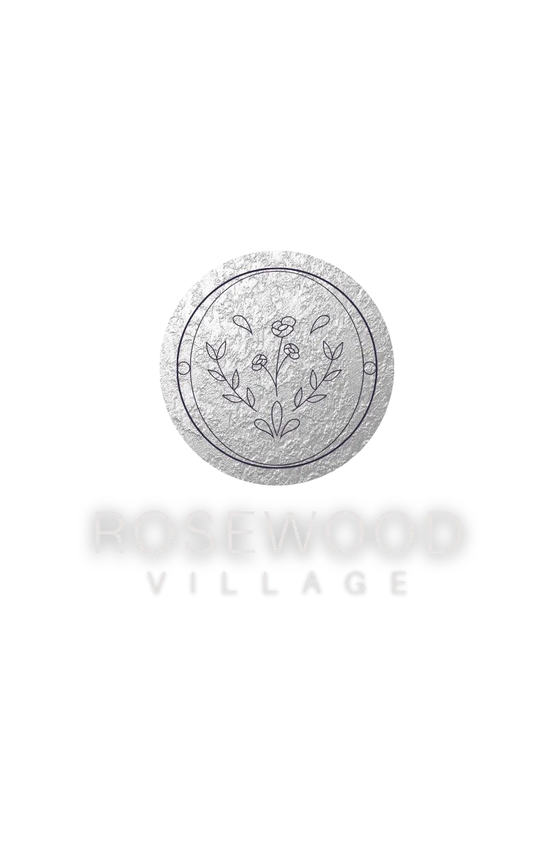 Rosewood Village apartment community logo featuring a textured silver circular emblem with minimalist floral line art above modern white &ldquo;ROSEWOOD VILLAGE&rdquo; lettering on a black background.