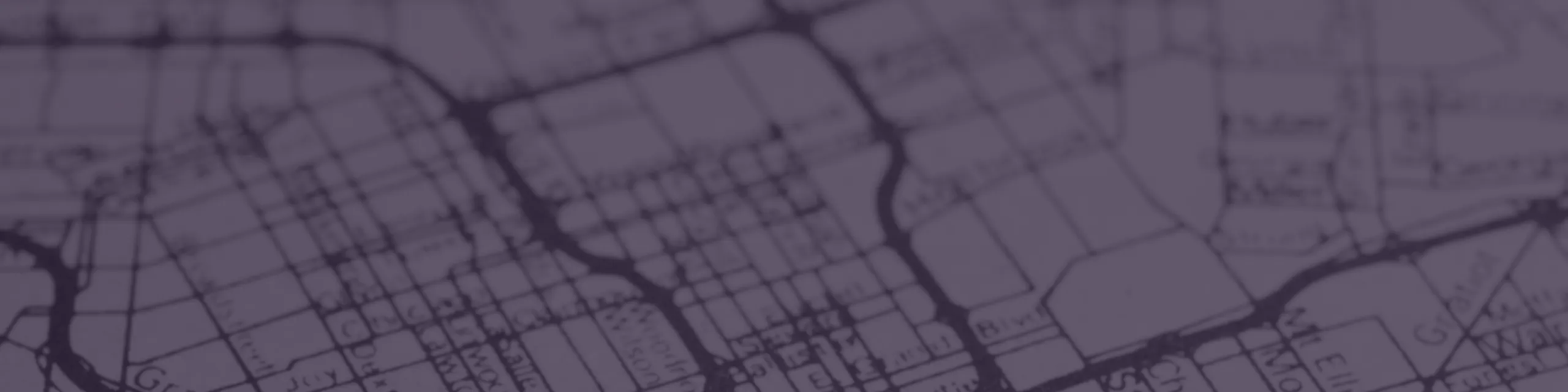 Blurred purple street map overlay, offering a creative and abstract view of urban design.