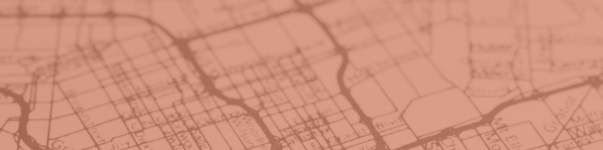 Vintage map illustration showcasing an intricate city street layout in warm sepia tones.
