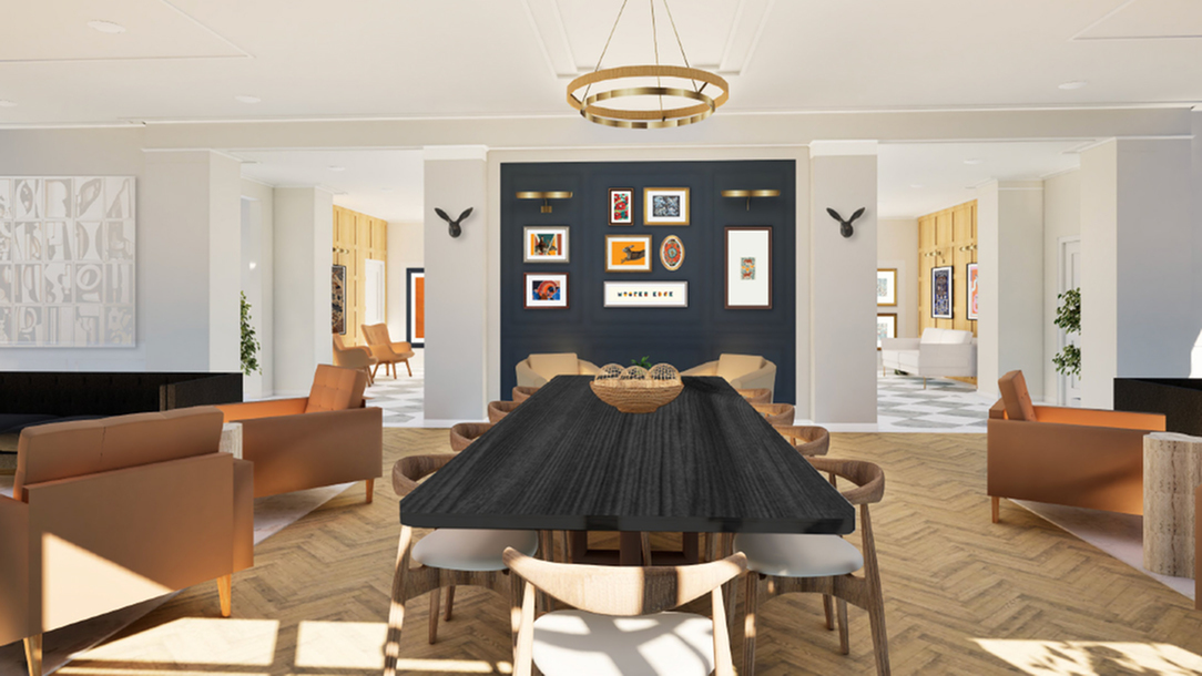 Elegant communal dining area with a modern black table, surrounded by stylish chairs, warm lighting, and chic wall art.