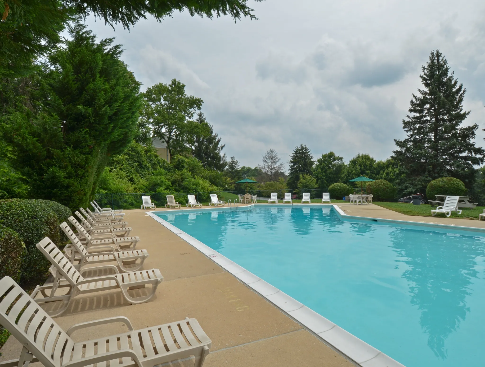 Norwood House Swimming Pool with White Chairs | Apartments In Downingtown