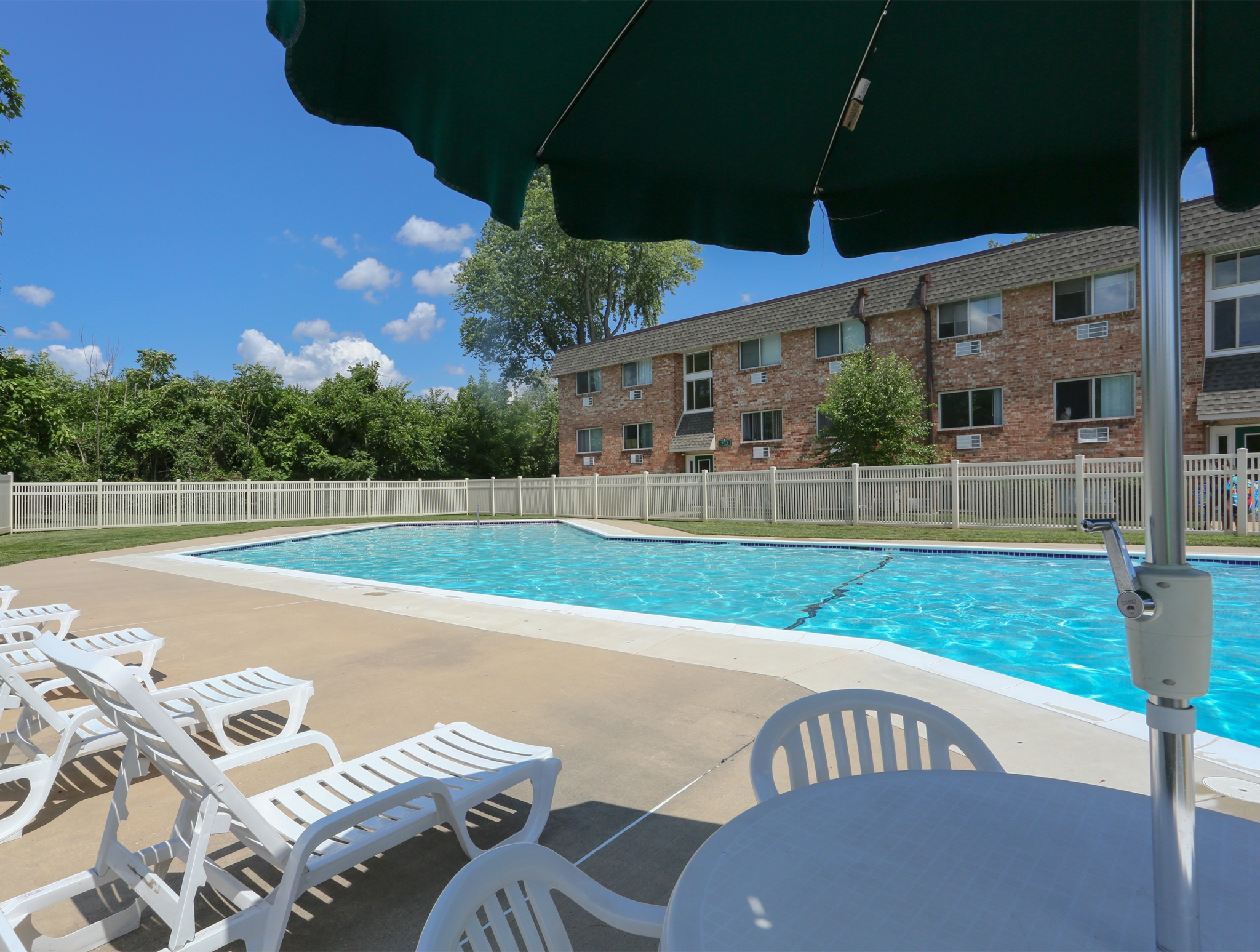 Mill Creek Village Swimming Pool with Umbrella Shade | Langhorne, PA Apartments