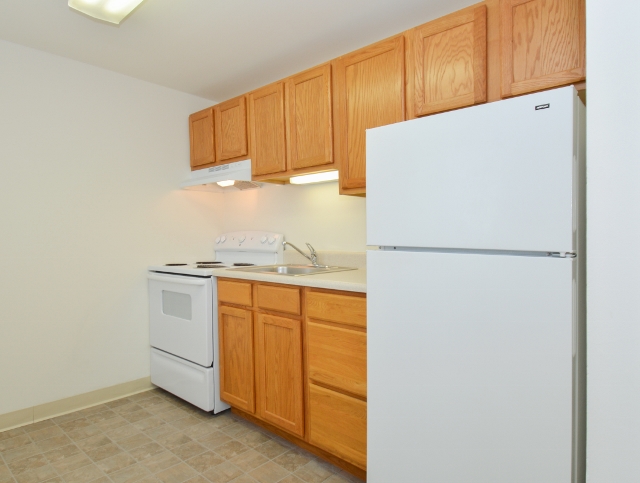 Boothwyn Court Sample Kitchen with Beige Tile Flooring | Apartments in Garnet Valley, PA