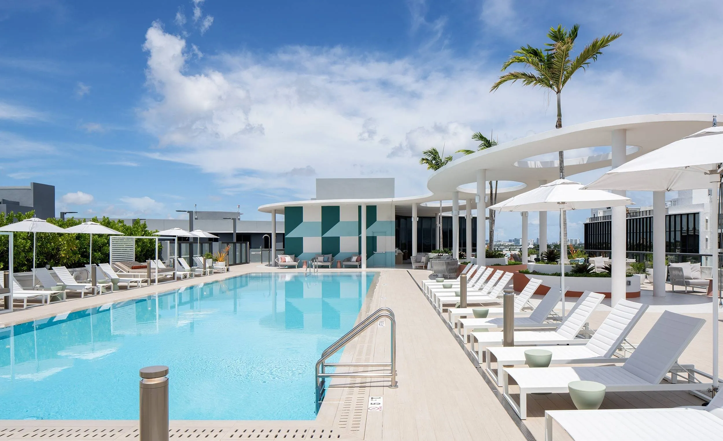 Rooftop pool with cabana seating