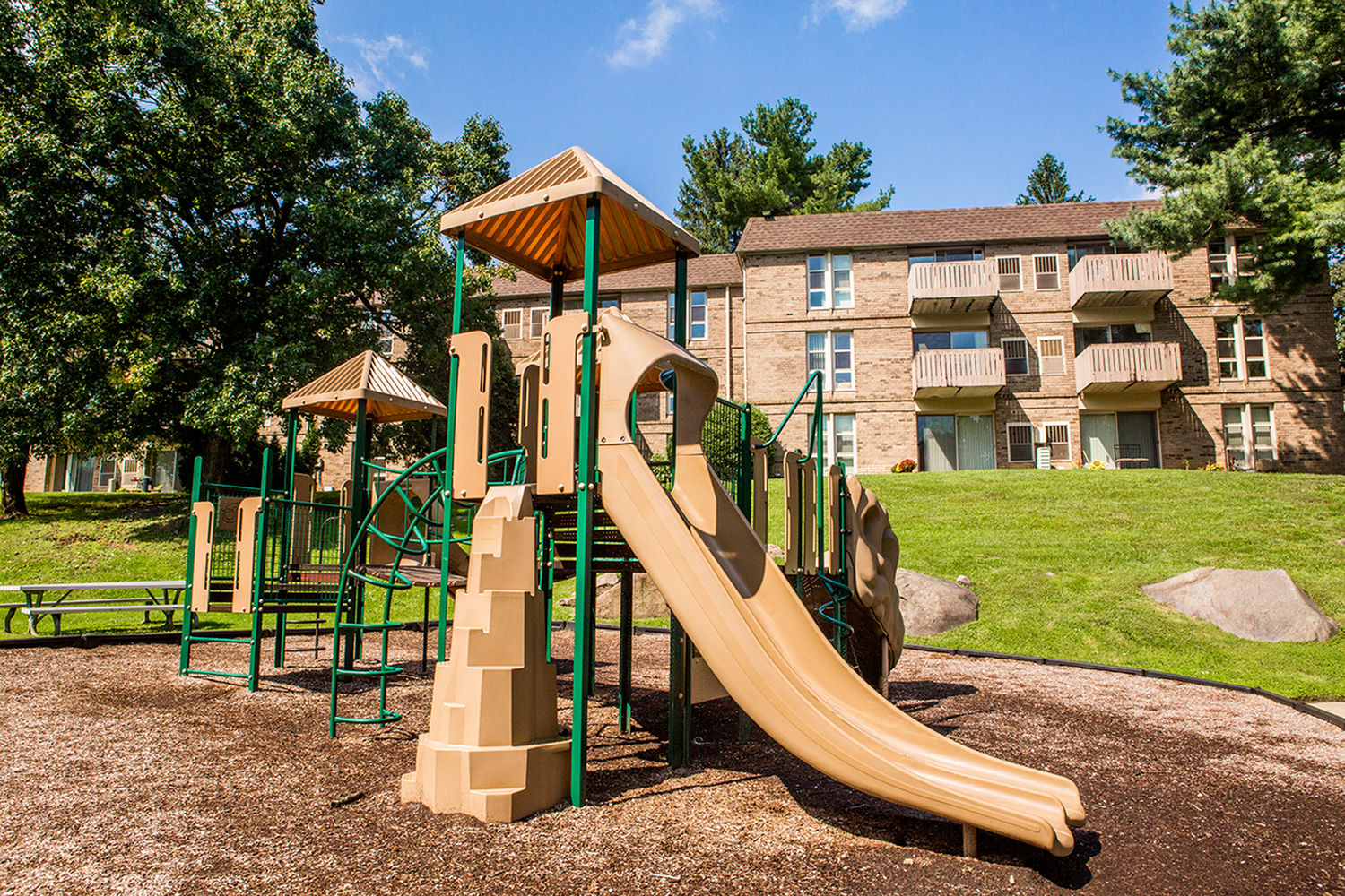 Children's playground with picnic tables