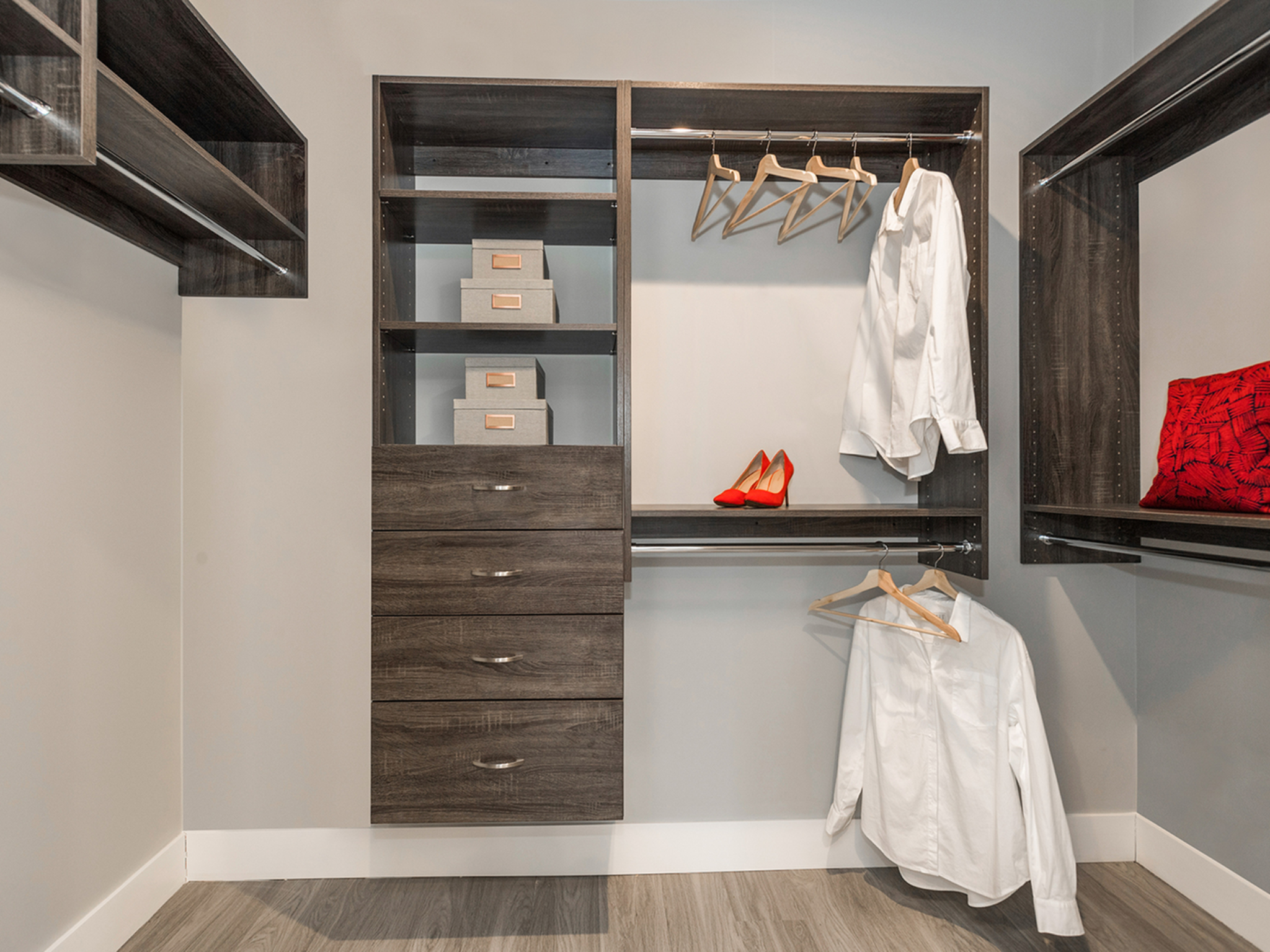Walk in closet with wooden shelving