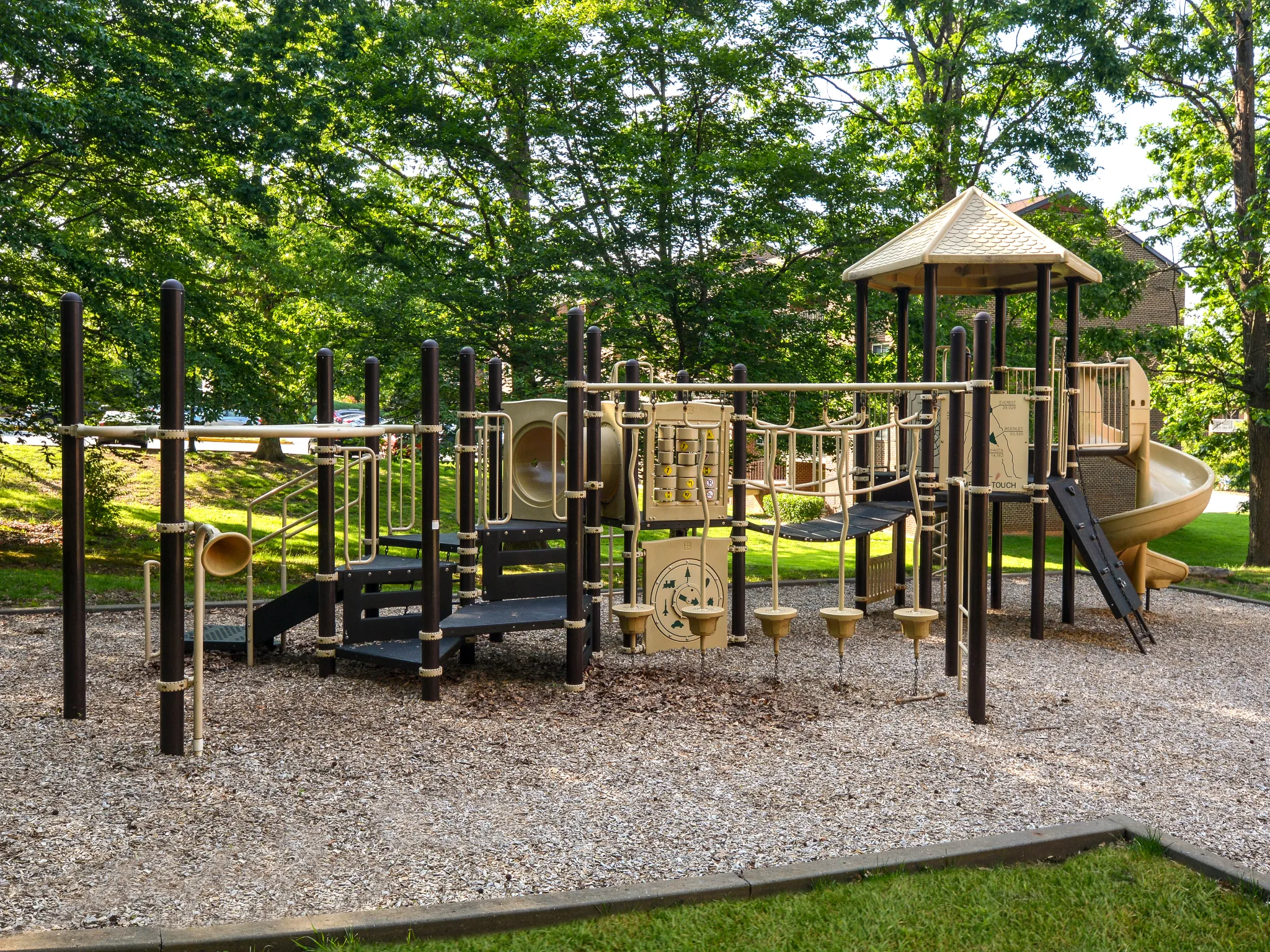 Children's playground with slide and climbing equipment.