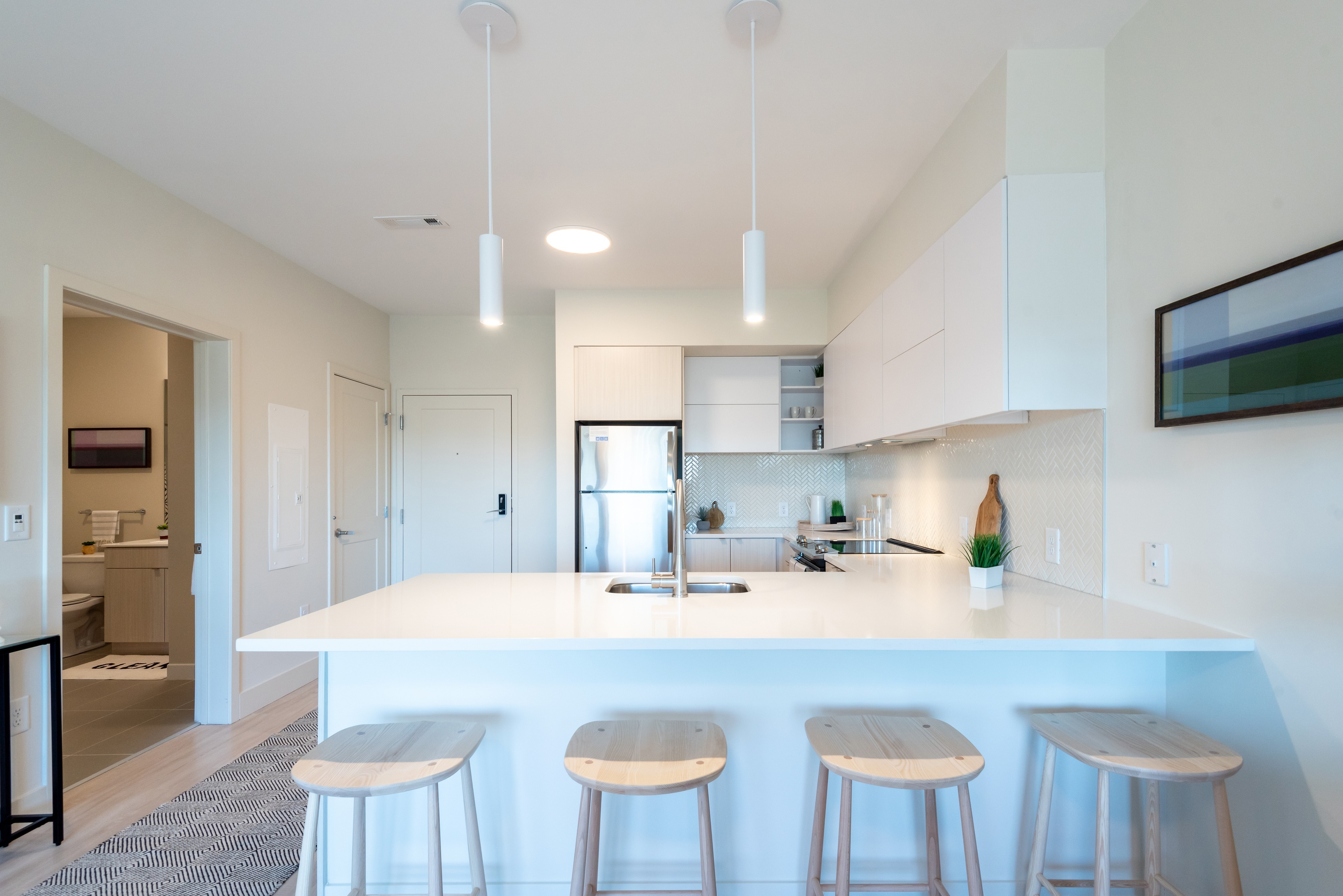 Apartment Kitchen with Breakfast Bar and Pendant Lights