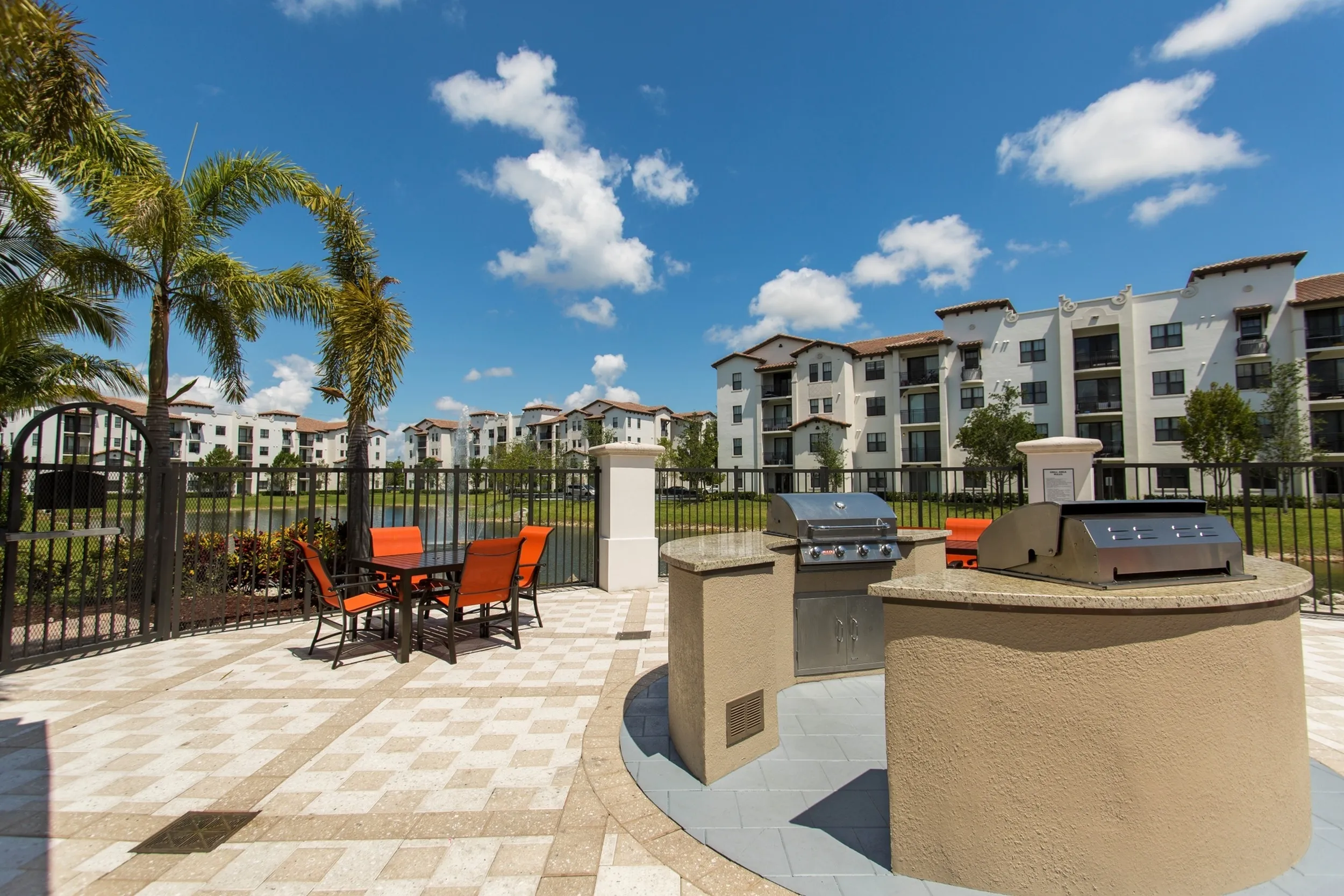 Lakeside outdoor living room with grilling stations