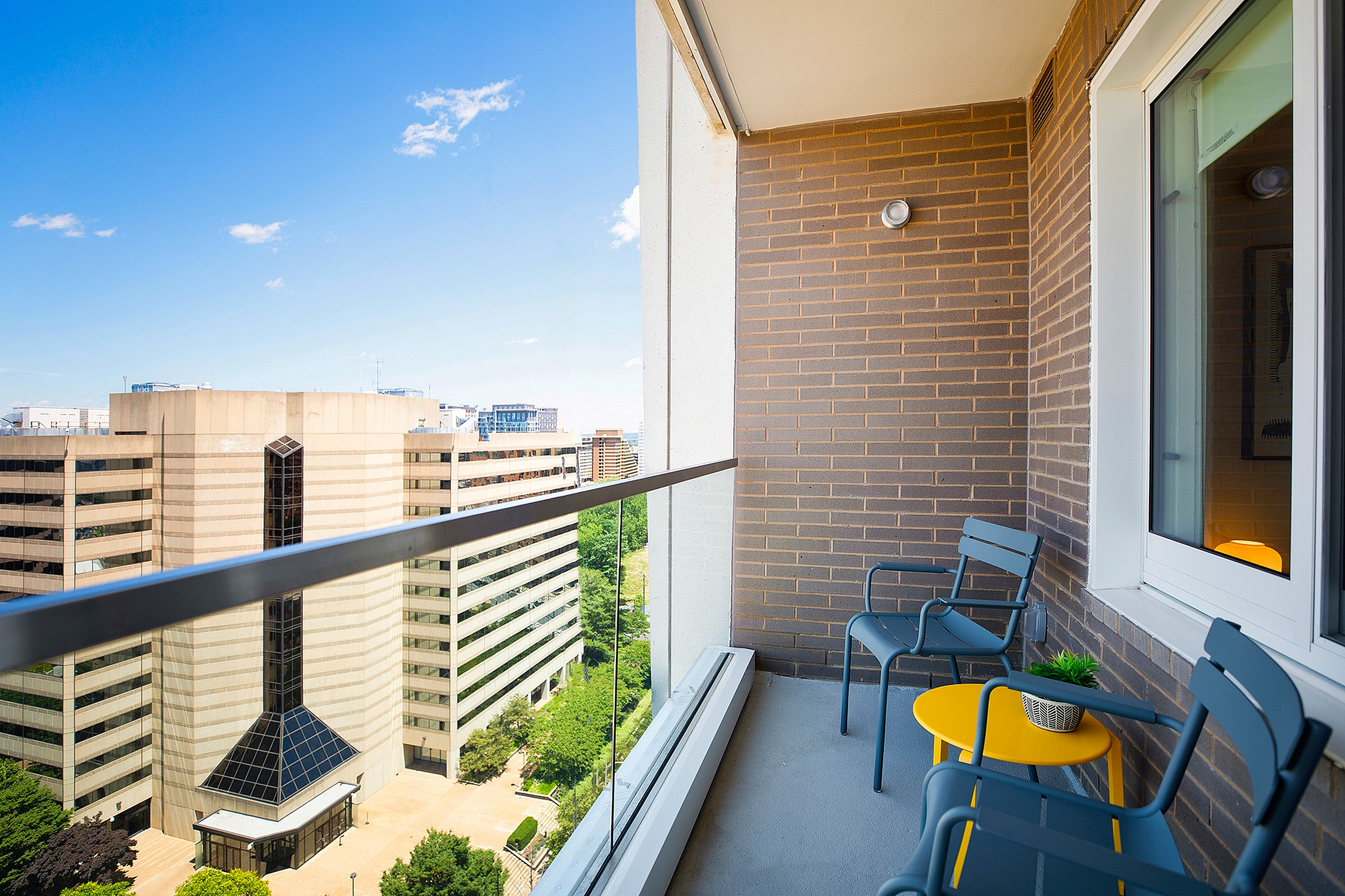 Balcony with two chairs and a table
