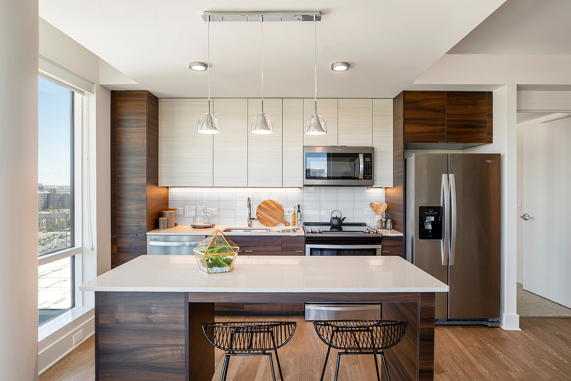 Contemporary kitchen with island and premium finishes