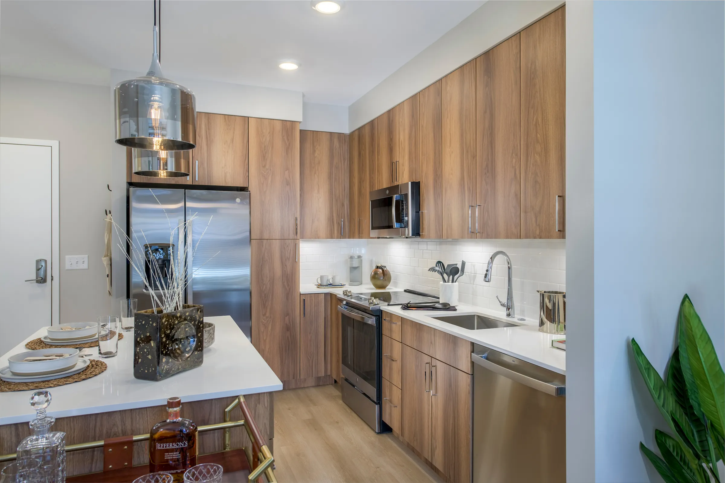 Quartz countertop and tile backsplash