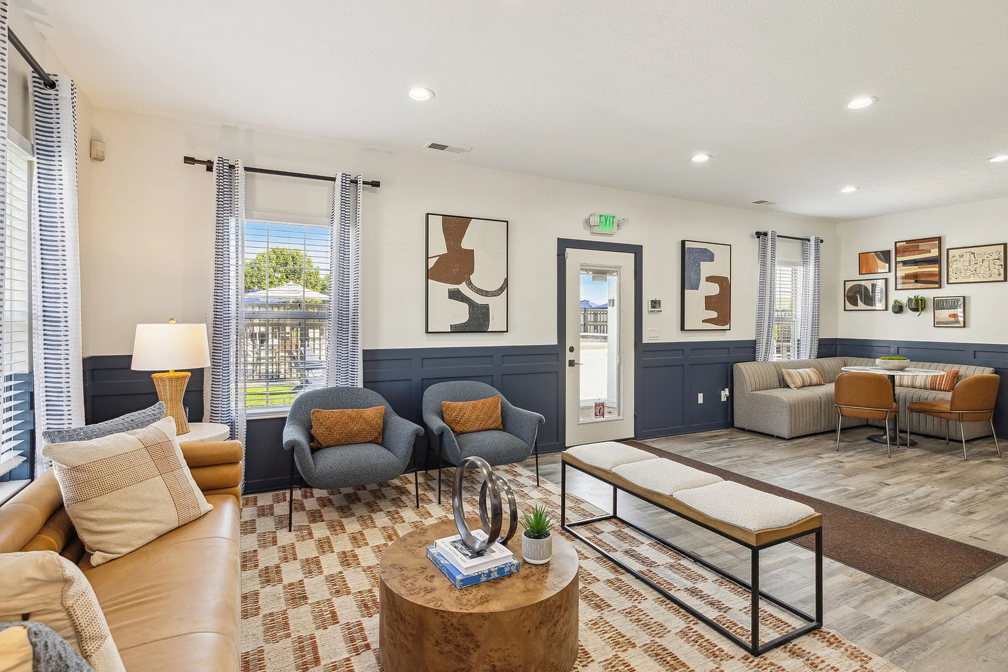 Inviting living room with stylish decor, cozy seating, and abundant natural light.