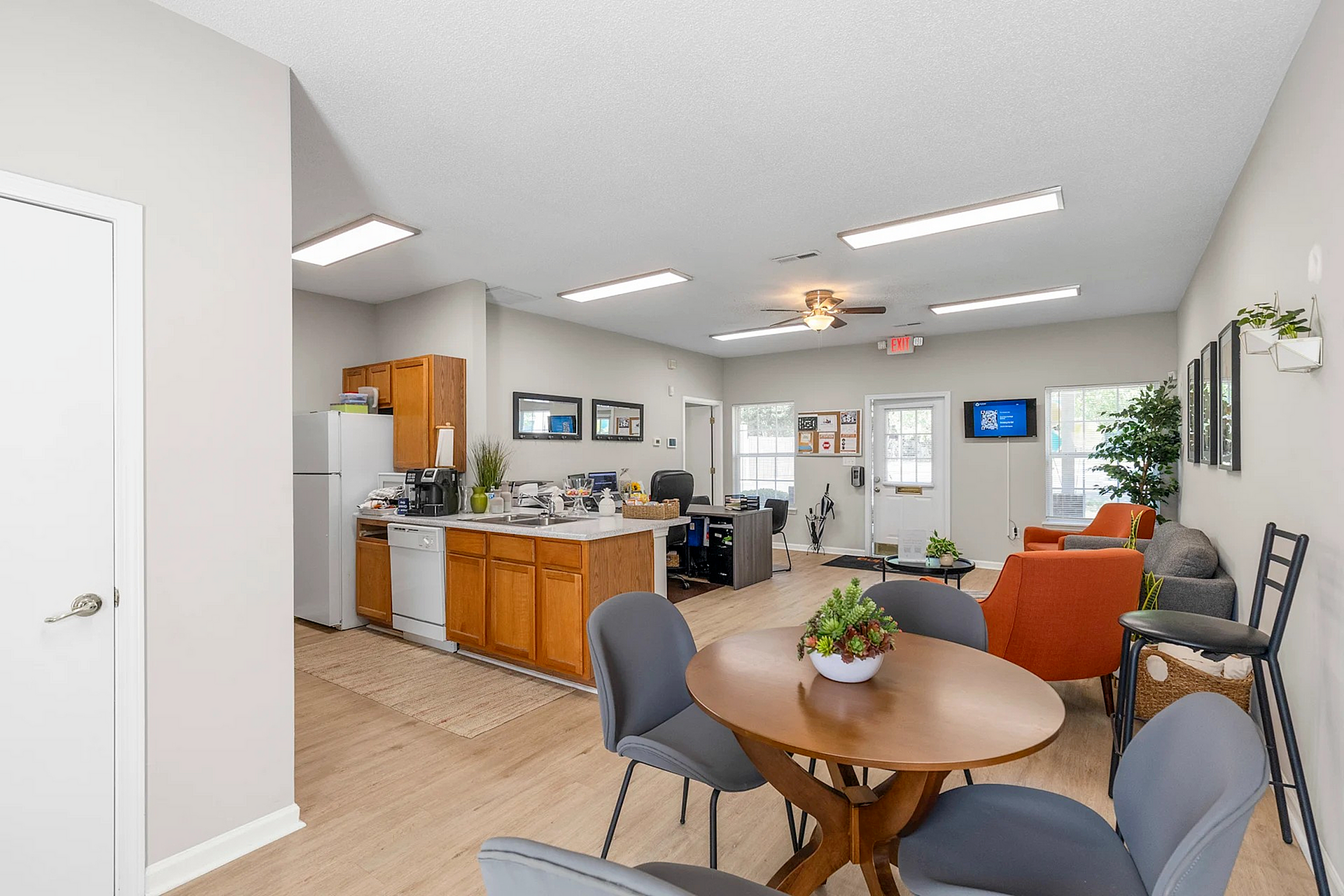 Inviting open-plan living space with a cozy dining area, modern kitchen, and stylish seating, perfect for relaxation and entertainment.