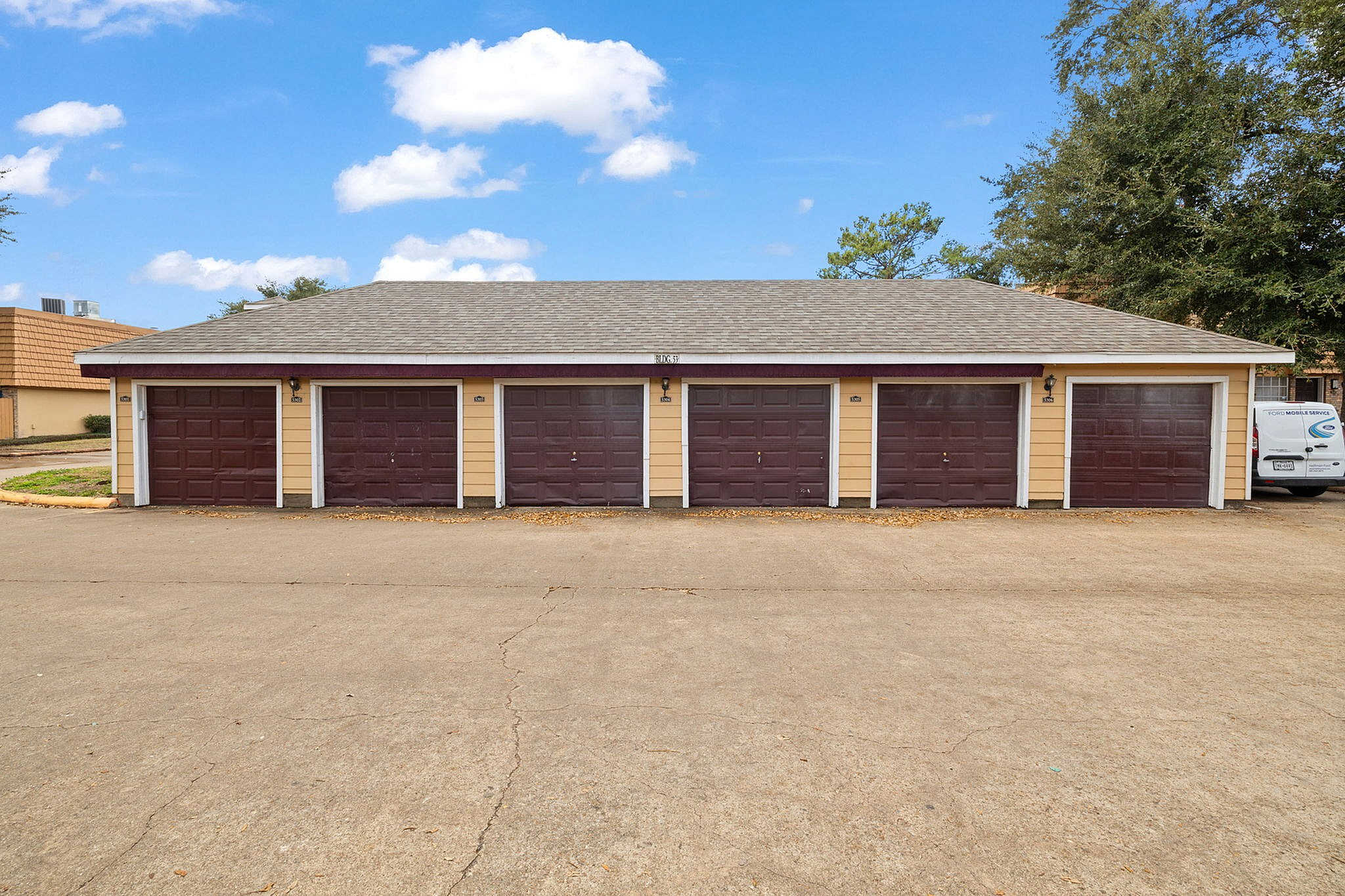 Charming multi-unit garage facility with vibrant doors, ideal for secure parking and storage.