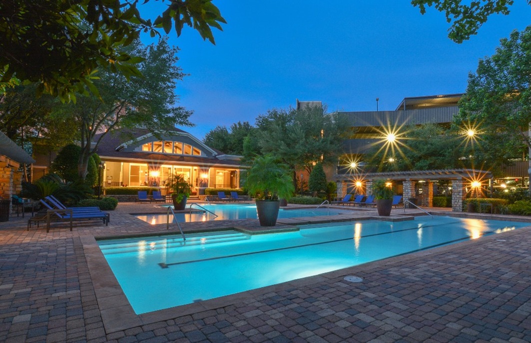 Pool lit up at night Villas at Hermann Park | Apartments | Houston, TX