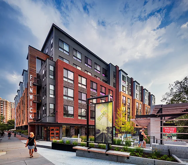 Modern urban apartment building with striking design, offering vibrant city living with a touch of elegance.
