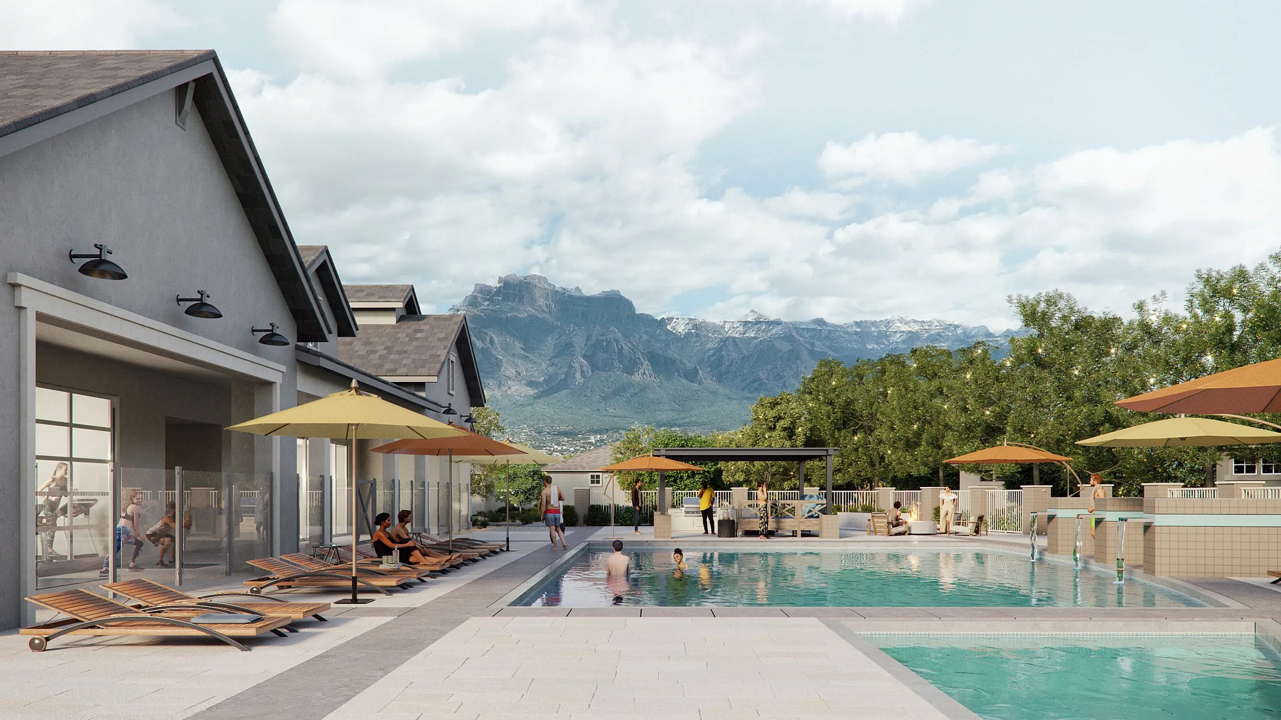 Luxurious apartment complex with a sparkling pool, modern lounge chairs, and stunning mountain views.