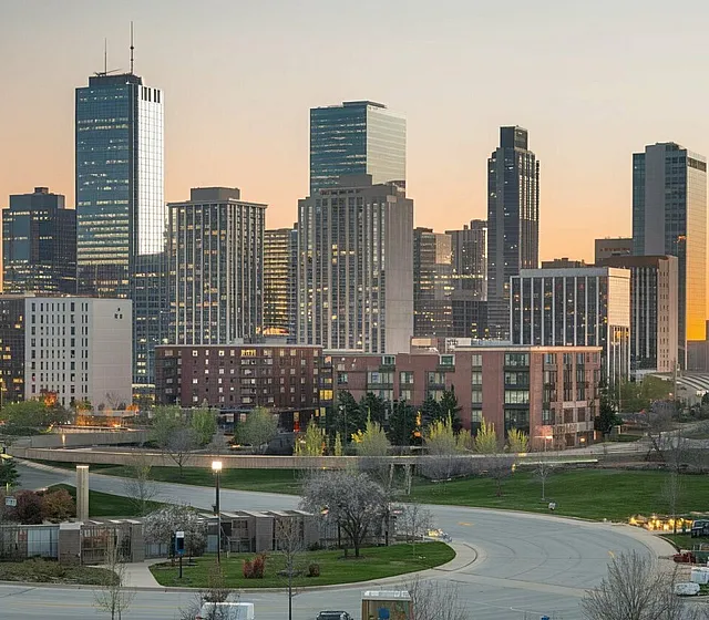 Breathtaking urban skyline view with modern high-rise buildings and vibrant cityscape at sunset.