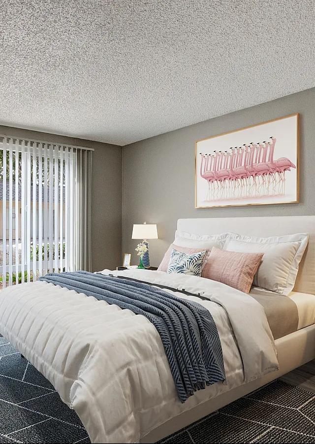 Bright and modern bedroom with elegant decor, featuring a cozy bed, stylish artwork, and large windows with natural light.