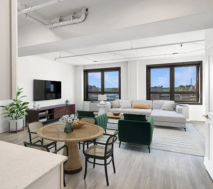 Contemporary apartment boasting an open-plan living area with stylish furniture, large windows offering scenic views, and a cozy dining space.