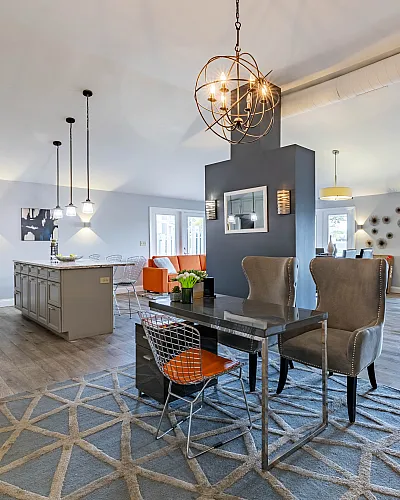 Gorgeous modern living space with open-concept design, featuring a sophisticated dining area, elegant lighting, and stylish d&eacute;cor.